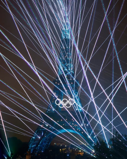 The Eiffel Tower is seen during a light display at the opening ceremony of the 2024 Paris Summer Olympic Games