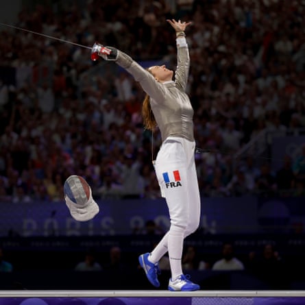 Manon Apithy-Brunet of France celebrates beating Sabine Choi of Korea in the semi-finals in the women’s individual fencing sabre.