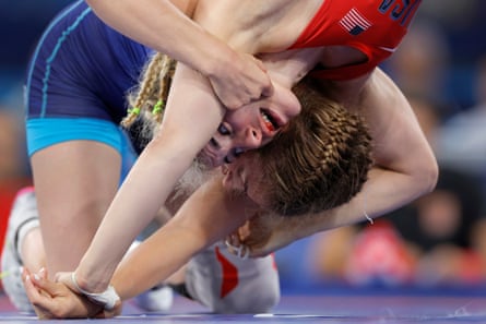 Helen Maroulis of the US (right) with a bloodied mouth during her victory over Alina Hrushyna-Akobiia of Ukraine during the quarter-finals of the women’s 57kg freestyle wrestling