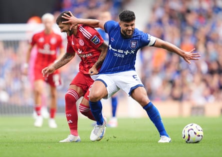 Ipswich Town captain Sam Morsy (right) tangles with Fortuna Dusseldorf’s Matthias Zimmermann