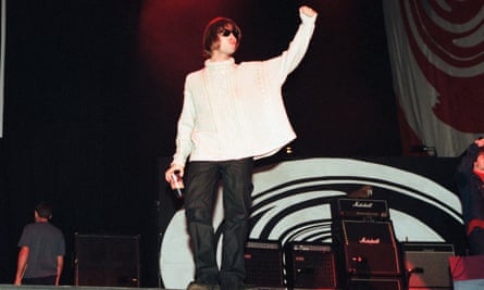 Liam Gallagher saluting the crowd at Knebworth.