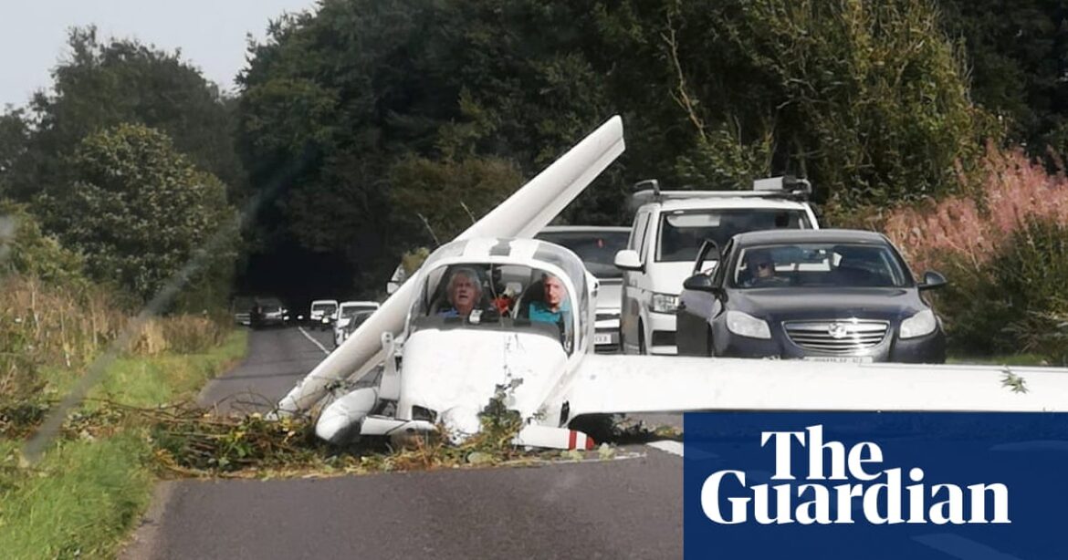 Two pilots survive light aircraft crash on busy road in Gloucestershire