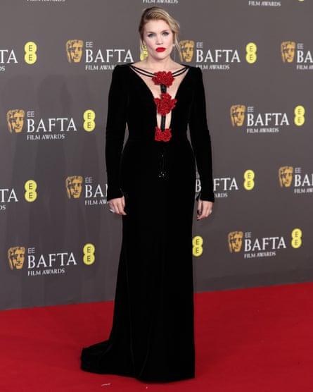 Emerald Fennell in a floor-length black dress on the Baftas red carpet