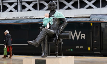 Campaigners tie baby slings to statues in call for better UK paternity leave