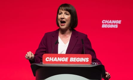 Rachel Reeves speaking at a podium bearing the slogan "Change begins"