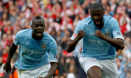 Manchester City's Yaya Touré (right) and Mario Balotelli celebrate Touré’s goal against Stoke in the 2011 FA Cup final