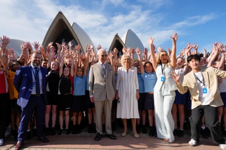 King Charles III and Queen Camilla pose for a group photo during their visit to the Sydney Opera House on Tuesday.