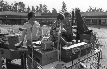 Chowning, left, preparing for a concert at CCRMA, 1981.