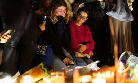 People gather during a vigil to celebrate Liam Payne’s life at Washington Square Park in New York.