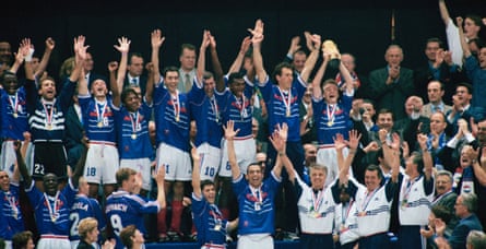 French players receive the World Cup trophy, after securing victory in the final of the 1998 World Cup against Brazil.