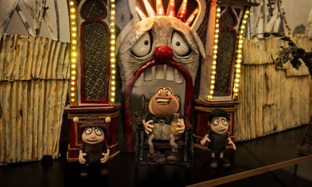 Memoir of a Snail’s main claymation characters in front of a Luna Park-style clown face 