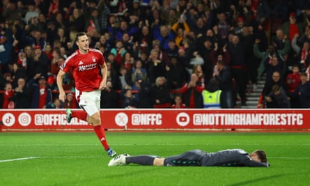 Dean Henderson lies with his face in the turf after failing to keep out Chris Wood’s effort