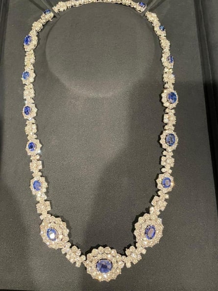 platinum necklace with dark blue gemstones