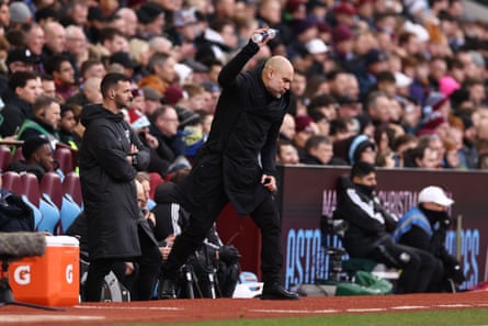 Pep Guardiola throws a water bottle in frustration.