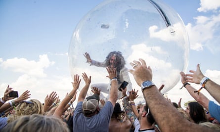 Coyne zorb-surfs over the crowd at Bourbon and Beyond music festival in Louisville, Kentucky in 2019