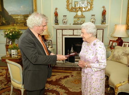 Rattle receives his Order of Merit from Queen Elizabeth II at Buckingham Palace in 2014.