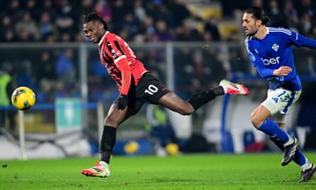 Rafael Leão lobs the ball towards the Como goal for Milan’s winner