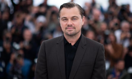 man in suit in front of crowd