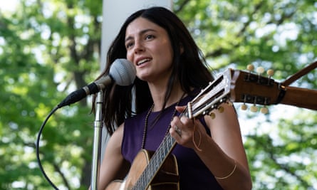 film still of a woman with a guitar