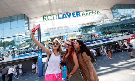 Spectators take a selfie outside Rod Laver Arena at Melbourne Park