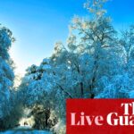 Parts of UK disrupted as snow and freezing rain arrive – live