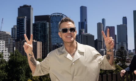 Thousands swarm to free Robbie Williams gig at maxed out Fed Square in Melbourne