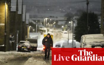 UK weather: ‘extensive flooding’ closes M5 in Gloucestershire as heavy snow and ice causes travel chaos across country – live