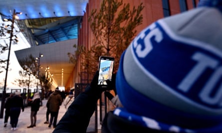 An Everton fan takes a picture of the new ground