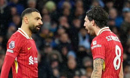 Dominik Szoboszlai celebrates with Mohamed Salah after scoring Liverpool’s second goal