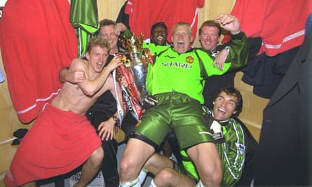 Peter Schmeichel at the centre of Manchester United’s celebrations with the 1999 Premier League trophy.