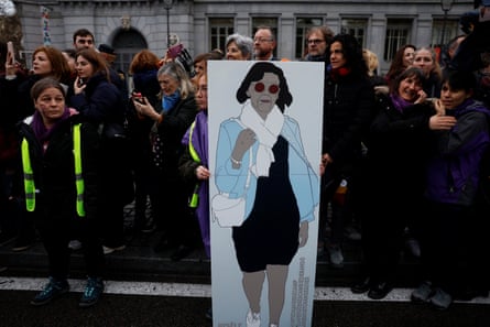 Woman holding sign