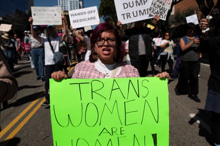 Person hold sign saying Trans Women are Women