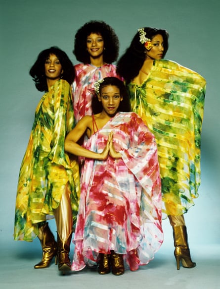 Sister Sledge in photo studio group shot, wearing exotic fabrics.