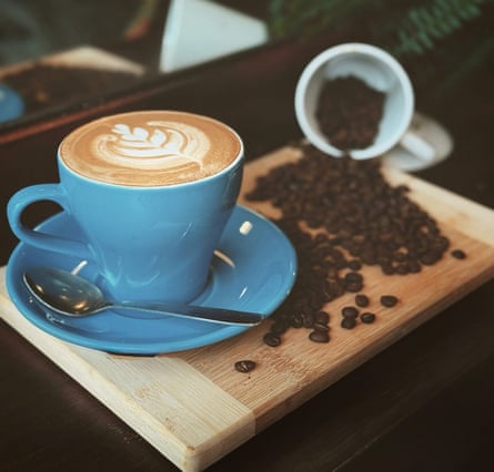 A cup of coffee and beans on a tray at Portobello Road’s The Coffee Plant.