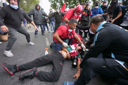 Photographer in coma after Argentina police hit pensioner protest hard