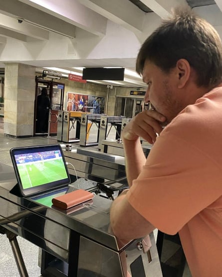 Maksym Tolovierov’s father, Vadym, watches his son in action at last year’s Euros via a tablet