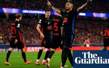 Raphinha strike and Szczesny saves help 10-man Barcelona edge Benfica