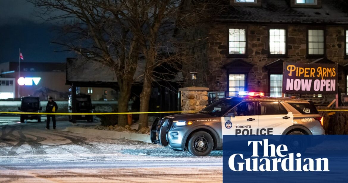 Three suspects at large after shooting at Toronto pub leaves a dozen injured