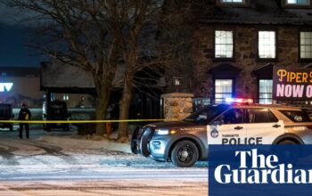 Three suspects at large after shooting at Toronto pub leaves a dozen injured