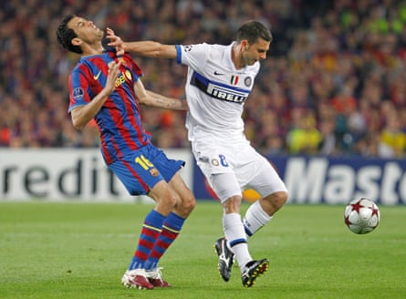 Barcelona’s Sergio Busquets is fouled by Inter’s Thiago Motta, who was shown the red card after the challenge