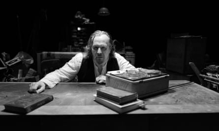 Gary Oldman sat at a desk in Krapp’s Last Tape.