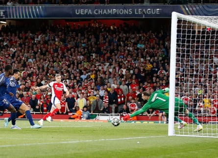 Gianluigi Donnarumma of PSG saves a shot by Arsenal’s Leandro Trossard in the first leg