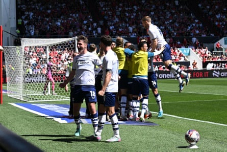 Milutin Osmajic is mobbed after Preston’s second goal