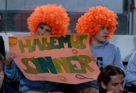 Supporters hold a banner welcoming back Jannik Sinner that says “Habemus Sinner” adapting the Latin phrase used after the election of a pope, “Habemus papam” – we have a pope.