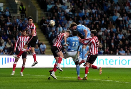 Jack Rudoni heads Coventry level in their playoff semi-final first leg against Sunderland.