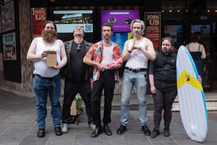 Competitors pose at the Nicolas Cage lookalike event for the film The Surfer.