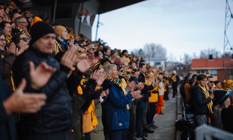 Bodø/Glimt fans cheer their team during their Eliteserien match against KFUM.