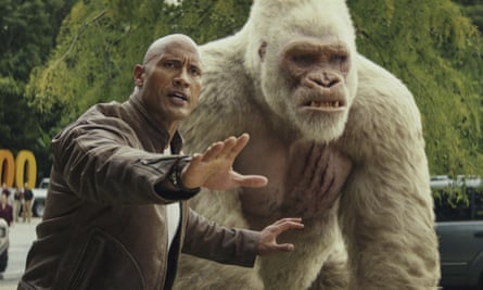 He gestures next to a giant animated gorilla